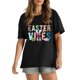 thumbnail image 1 of Camiseta gráfica de conejito "Easter Vibes" para mujer: negra, camiseta informal de cuello redondo con diseño colorido de huevo de Pascua y conejo, suave 100 % algodón, perfecta para celebraciones de, 1 of 5