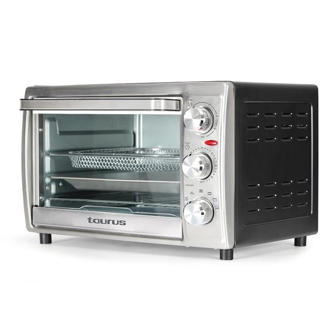 horno freidora de aire taurus 20 litros acero inoxidable 3/4 frontal, horno eléctrico plateado con puerta de vidrio y logo Taurus, tres perillas laterales para temporizador (hasta 60 min), selector de temperatura (hasta 230 °C) y funciones, bandeja y canasta visibles, capacidad 20 L; también suele usarse para tostar y dorar alimentos.