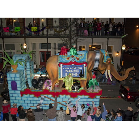 Costumed men ride on elephants back Mardi Gras began in Mobile Alabama in 1703 when it was a colony of French soldiers Colorful beads and Moon Pies are thrown from the floats Poster Print by Carol Hig
