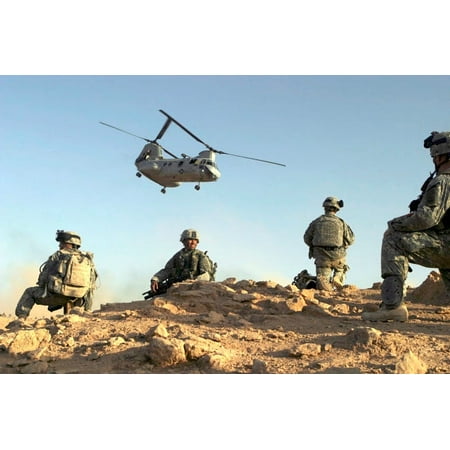 US Army Soldiers set up a security perimeter as a CH-46 Sea Knight departs Poster Print by Stocktrek
