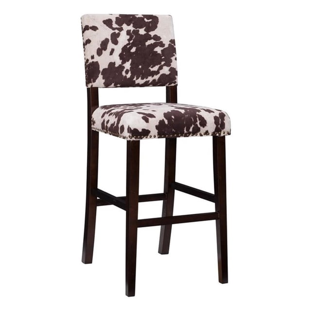Linon Corey Tabouret de Bar de 30 Pouces à Motif Vache avec Cadre en Bois Espresso Foncé. Ce Tabouret de Bar Présente un Rembourrage en Microfibre à Motif Peau de Vache Brun et Blanc avec Garniture de Tête de Clou en bronze antique. le Cadre Robuste en Bois Massif Est Teinté d'Une Riche Finition Espresso Foncé et Comprend des Rampes pour une Stabilité et un Confort Accrus. l'Assise et le Dossier Rembourrés Offrent un Soutien, le Rendant Adapté aux tables de Bar Ou de pub de 41 Pouces à 43 Pouces de Hauteur. Dimensions : 18 Pouces L x 22 Pouces P x 44