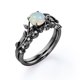 thumbnail image 4 of JeenMata Anillo Nupcial con Diseño de Hoja de Rama de Moissanita y Ópalo de Fuego Redondo de 0,65 Quilates Engastado en Solitario con Garras en Baño de Oro Negro de 18 K sobre Plata, 4 of 6