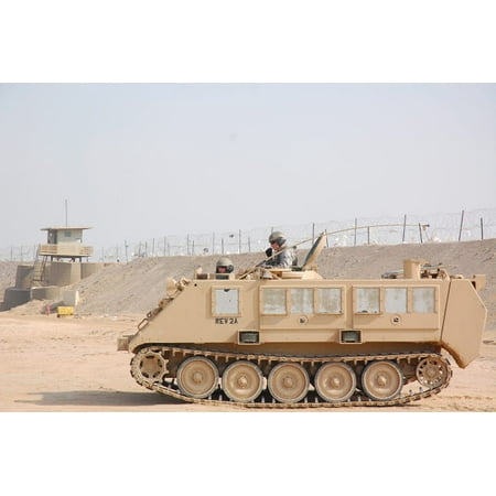 Soldiers patrol in an M-113 Armored Personnel Carrier Poster Print by Stocktrek