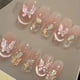 thumbnail image 4 of Nuevo diseño de uñas trapezoidales largas para niña con diseño de atrapasueños y armadura con acabado de mariposa y purpurina blanca, diseño de uñas extraíble, 4 of 5