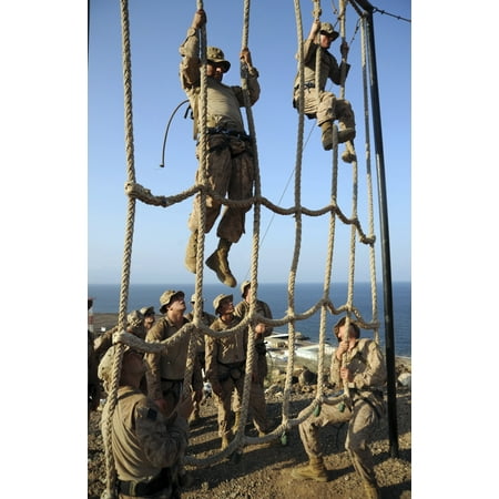 Marines climb ropes while running through an obstacle course at a Combat Training Center Canvas Art - Stocktrek Images (23 x