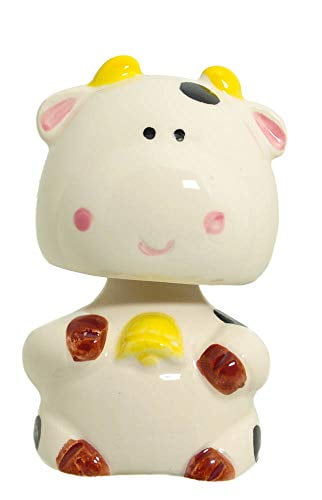 cow with toy car on head