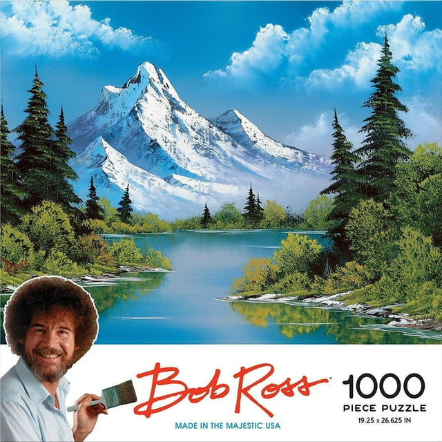 Bob Ross: Casse-Tête Mountain Reflections (1000 Pcs) Montrant un Casse-Tête en Carton Achevé d'Une Montagne Enneigée Se Réfléchissant dans un Lac Bleu Calme Entourée d'Arbres à Feuillage Persistant et de Buissons Verts, Mesurant 19,25 par 26,625 Pouces, Convient au Jeu Créatif Familial.