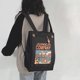 thumbnail image 2 of Mochila de lona con estampado de dibujos animados para mujer, moderna, sencilla, informal, versátil, estilo universitario, para estudiantes y ordenador, 2 of 5