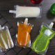 thumbnail image 5 of Muyoka Bolsas transparentes para bebidas, 50 unidades, de plástico, para licor, con boquilla y 2 embudos, 100/200/500 ml, contenedor de bebidas para bebidas frías y calientes, bebidas alcohólicas, ron Muyoka Hogar, 5 of 7