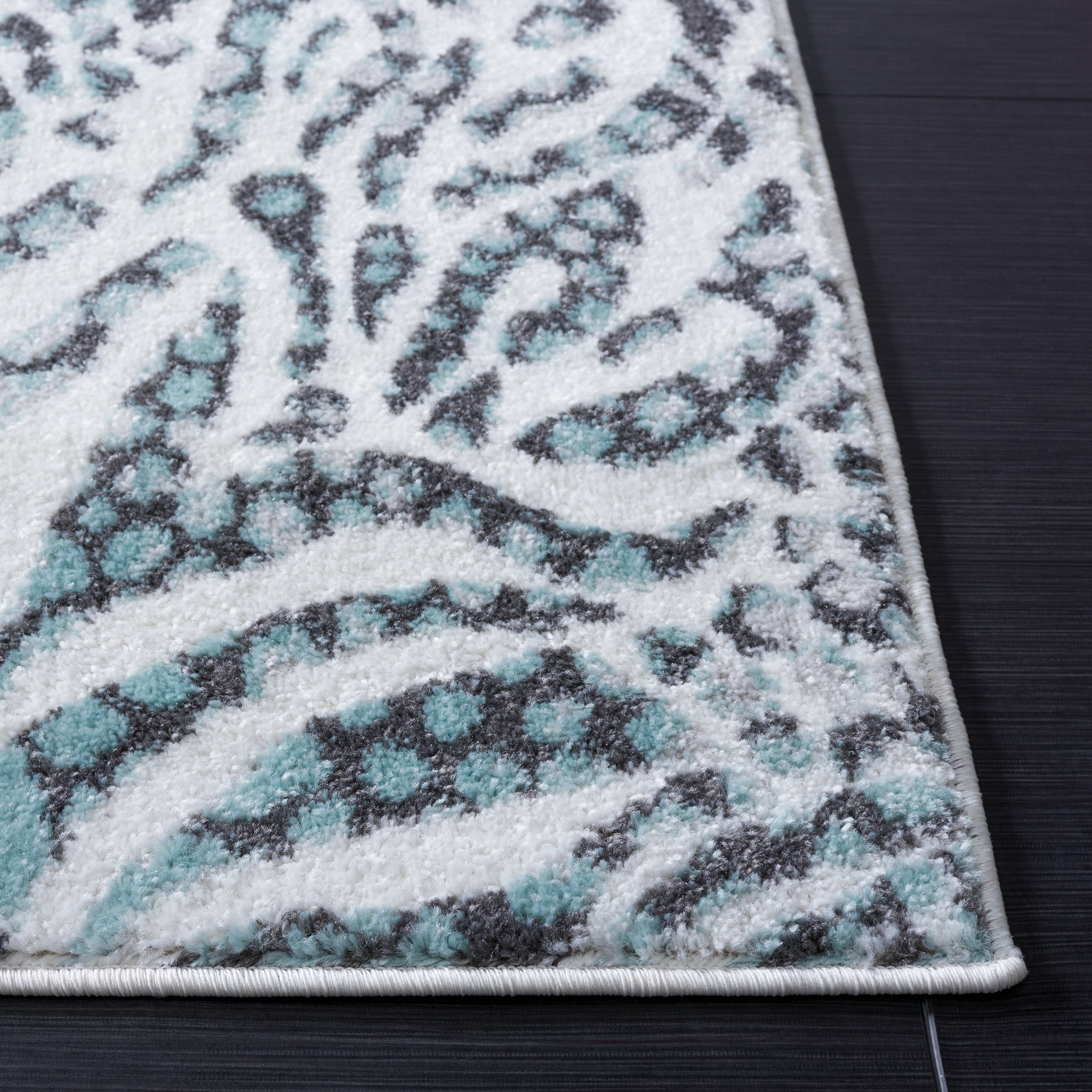 SAFAVIEH Amsterdam Ruby Animal Area Rug, Ivory/Teal, 6'7" x 9'2"