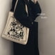 thumbnail image 2 of Bolso de lona de moda con estampado literario, bolso de compras de gran capacidad para mujer, bolso de tela de algodón, bolso de mano sencillo y versátil para ocio, 2 of 5