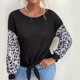 thumbnail image 1 of Liquidación ICHUANYI, jersey de punto negro con tiras cruzadas y estampado de leopardo y cuello redondo para mujer, Tops de manga larga recreativos ICHUANYI WER202308232835, 1 of 8