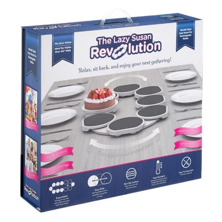 The Lazy Susan Revolution, a patented expandable lazy susan turntable for rectangular and oblong tables, shown in its packaging. Ideal for kitchen organization, it features heat-resistant and non-slip trays, easy assembly, and is perfect for family gatherings and parties. The product is dark gray and includes options for additional trays to fit various table sizes.