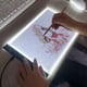 thumbnail image 3 of Tablero de Dibujo para Niños A4 con 3 Niveles de Brillo Ajustable, Luz LED, Mesa de Copia y Dibujo, 3 of 5