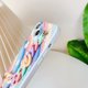 thumbnail image 3 of Funda suave para iPhone con correa de pulsera de flores de arcoíris (colorido, iPhone 13) JM, 3 of 6