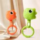 thumbnail image 1 of Juguete y sonajero de dentición de dinosaurio | Timbre de mano de silicona suave para bebés | Sonido relajante | No tóxico Fácil de limpiar | Desarrollo sensorial oral | Verde Naranja, 1 of 6