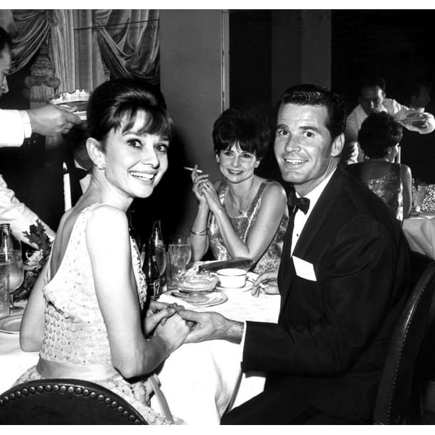 Audrey Hepburn James Garner and Lois Clarke Garner share a table at the ...