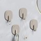 thumbnail image 1 of Ganchos de pared adhesivos resistentes (paquete de 4) | Ganchos de plástico para puerta, estilo crema | Sin costuras, soportan hasta 15 kg | Perchas para toallas de cocina y baño | Ganchos adhesivos, 1 of 5
