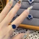 thumbnail image 3 of Anillo de mujer delicado con diseño de corte medieval elegante y vintage de Y&Y con un avanzado sentido del corindón azul irregular con microincrustaciones, 3 of 5
