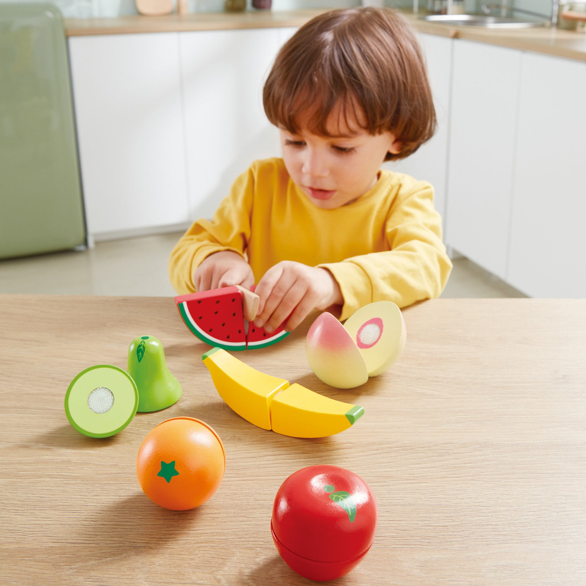 Hape: Fruit Set - 7pc, Wooden Food Play Set, Knife & Velcro Stick Together Fruit Pieces, Cut In Half, Kitchen Pretend Play, Realistic Toy, Kids Age 3+