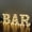 White, variant on BAR - Illuminated LED Marquee Word Sign - Pre-Lit Pub Bar Sign - Battery Operated (23.03-in x 8.66-in) (Black)
