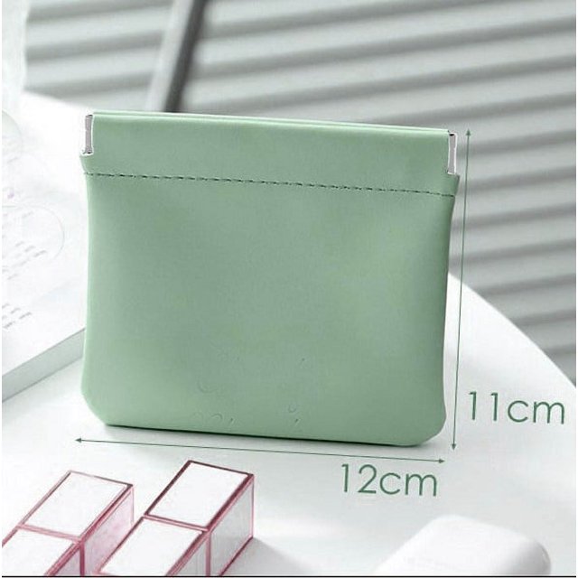 Mini bolsa de cosméticos portátil de cuero popular, pequeña bolsa de almacenamiento con cojín de aire para lápiz labial, bolsa para auriculares, artículos diversos
