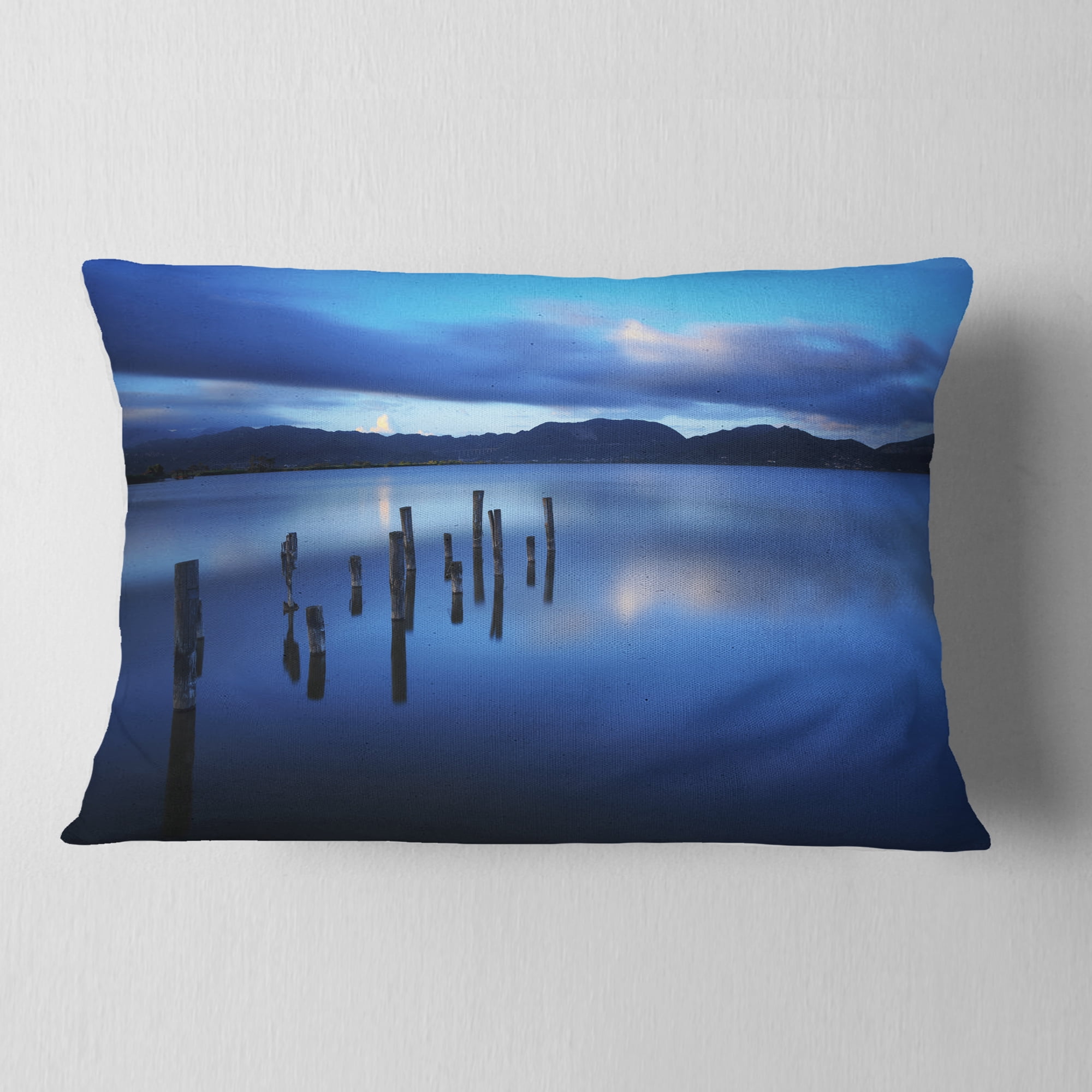 Designart Dark Blue Sea with Pier Remains - Seascape Throw Pillow - 12x20