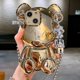 thumbnail image 1 of Estuche para iPhone 13 YONGSHENG Estuche de dibujos animados 3D Oso de Peluche Dorado con Correa de cadena de metal colgante de campana, 1 of 5