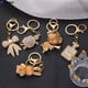 thumbnail image 4 of Llaveros de moda con lazo de Koala para mujer y niña, llaveros con diamantes de imitación brillantes, Cartera de bolso, adorno colgante, regalos, 4 of 4