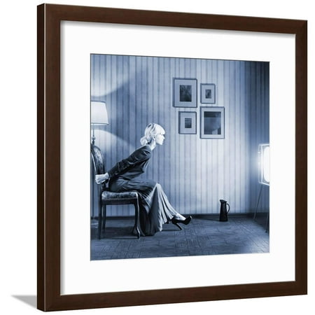 Young Woman Sitting on a Chair in Vintage Interior and Watching Retro TV Framed Print Wall Art By