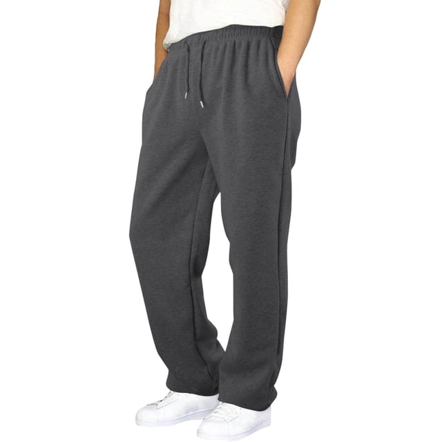 hoksml boys fleece-lined sweatpants in a solid dark grey color, featuring an elastic waist with an adjustable drawstring and side pockets. These thermal sports long pants are designed for winter wear, offering warmth and comfort. Suitable for casual, outdoor, and daily activities, the pants are shown worn by a model with white sneakers.