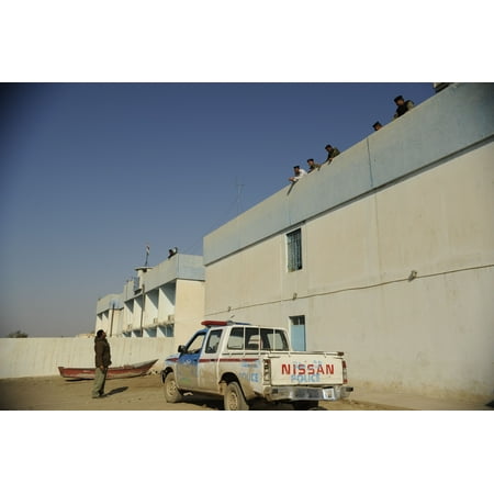 Canvas Print Iraqi policemen chat with each other at an Iraqi police station in Nimrud, Iraq, Dec. 15, 2008. Stretched Canvas 10 x (Best Police Station In India)