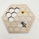 thumbnail image 1 of Juego de 10 portavasos de madera artesanales con diseño de panal de abeja, ideal para decoración festiva y protección de mesas., 1 of 4