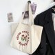 thumbnail image 3 of Bolsa De Hombro Bolso de lona con estampado de tulipanes y letras de gran capacidad para estudiantes Sywqhk Para Estrenar, 3 of 9