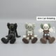 thumbnail image 3 of 1Pcs 9cm Figura De Anime KAWS XX Ojos Postura Mentir PVC Figuras De Acción Modelo Juguetes Muñeca Decoración De Coche Para Habitación Edición Limitada 2023 Regalo De Cumpleaños Para Amigos, 3 of 4
