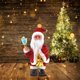 thumbnail image 1 of Muñeco de Papá Noel con campana que suena y luz que se mueve, juguete eléctrico que se balancea y funciona con 3 pilas AAA, productos para las fiestas navideñas, 1 of 1