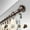 Bronze, variant on Central Design 100-49-482 1 in. Dia. Amber Curtain Rod, Black - 48-84 in.