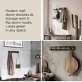 thumbnail image 4 of Perchero de pared Umbra Flip con 5 ganchos abatibles, negro y nogal, 4 of 9