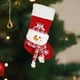 thumbnail image 4 of Pieza decorativa navideña roja de 20 pulgadas con una cálida combinación de copos de nieve y medias navideñas. Muñeco de nieve., 4 of 5