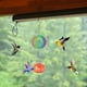 thumbnail image 1 of Alimentador de colibrí pintado con forma de campana de viento, colgante para exteriores, refractor de luz solar, 1 of 5