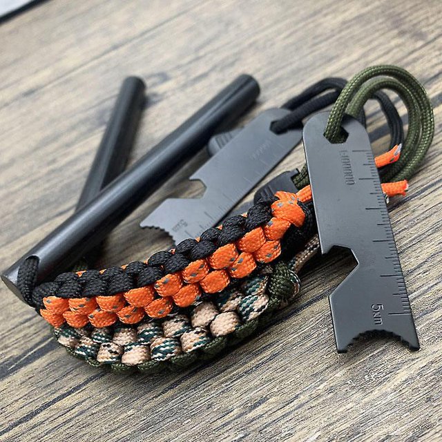Arrancador de fuego Sincero con varilla de ferrocarril perforada acero mango de cordón de Paracord percutor y silbato para kits de supervivencia de emergencia senderismo camping