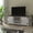 White, variant on BizChair Modern Farmhouse Barn Door TV Stand - Gray Wash Oak for TV's up to 65 Inches - 59" Entertainment Center with Adjustable Shelf