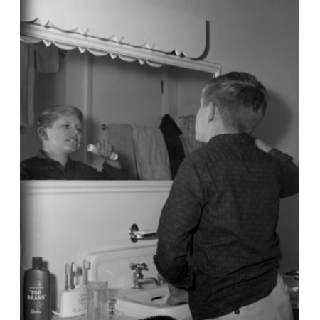 Boy brushing teeth with electric toothbrush Canvas Art - (24 x 36)