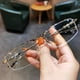 thumbnail image 1 of Gafas de miopía con montura de media montura que cambian de color y con alambre dorado para hombre y mujer, modernas, combinables con todo, con luz azul, 1 of 5