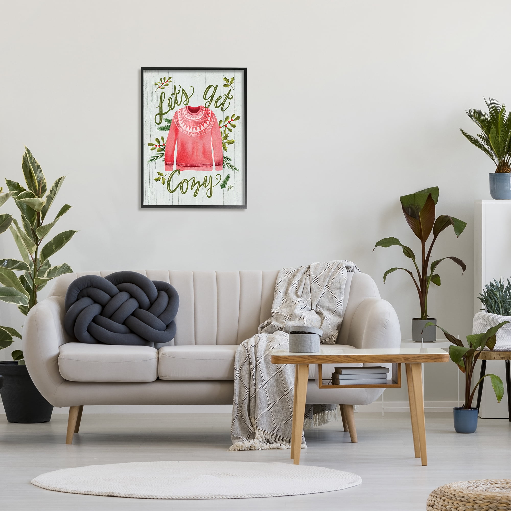 Stupell Industries Let's Get Cozy Holly Plants Pink Winter Sweater Graphic Art Black Framed Art Print Wall Art, 24x30, by Jackie Quigley