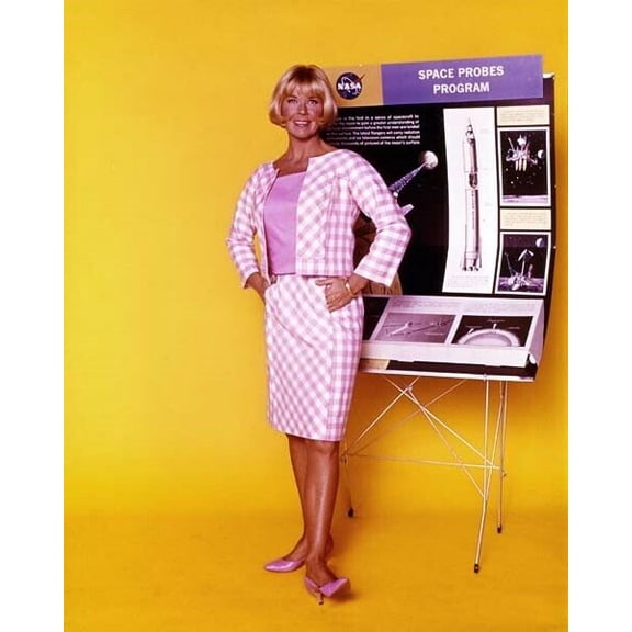 Doris Day 1960's in pink jacket & skirt stands by NASA Space Probes display