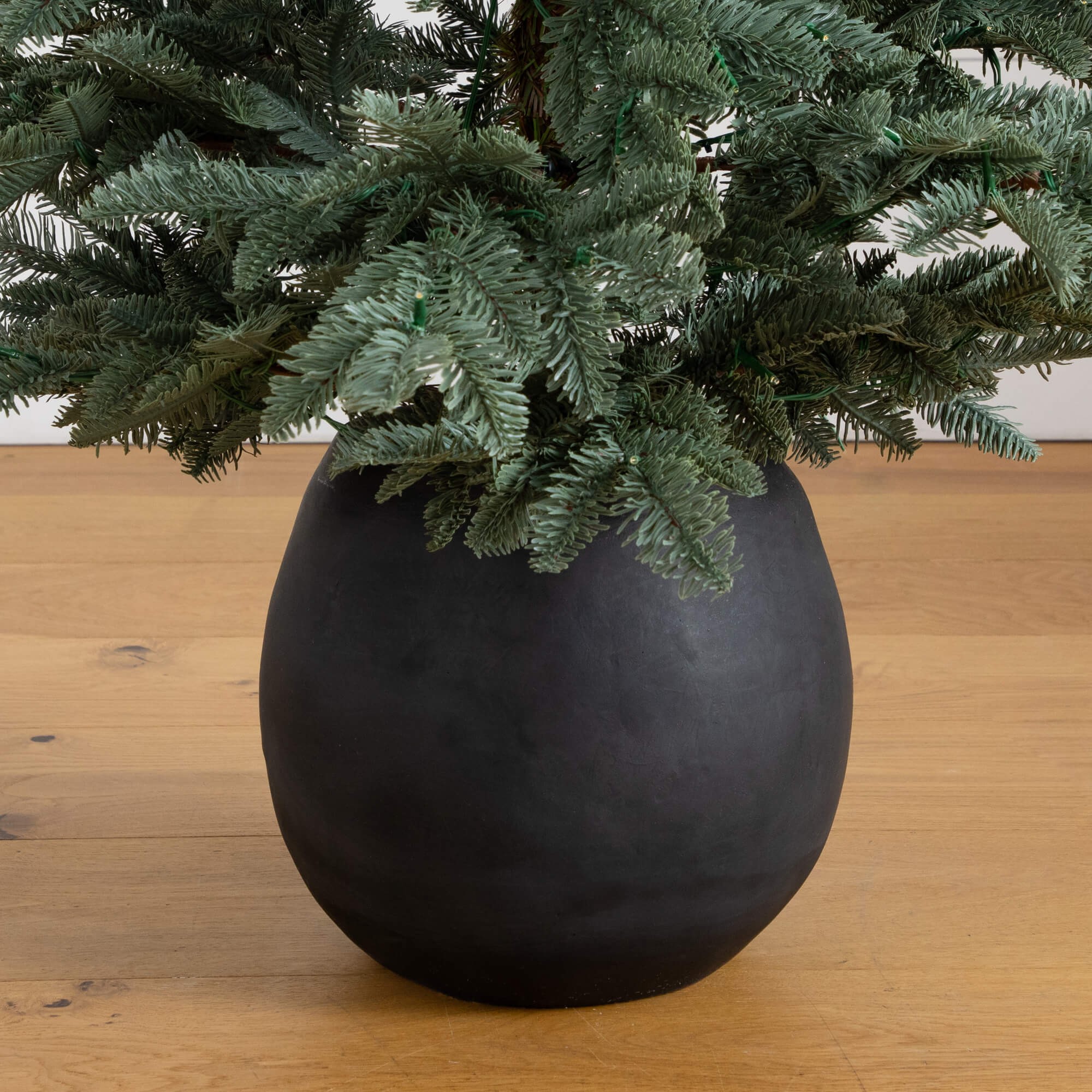 Nearly Natural 6ft. Pre-Lit Artificial Pine Christmas Tree in Round Black Decorative Planter with 60 Warm White LED Lights