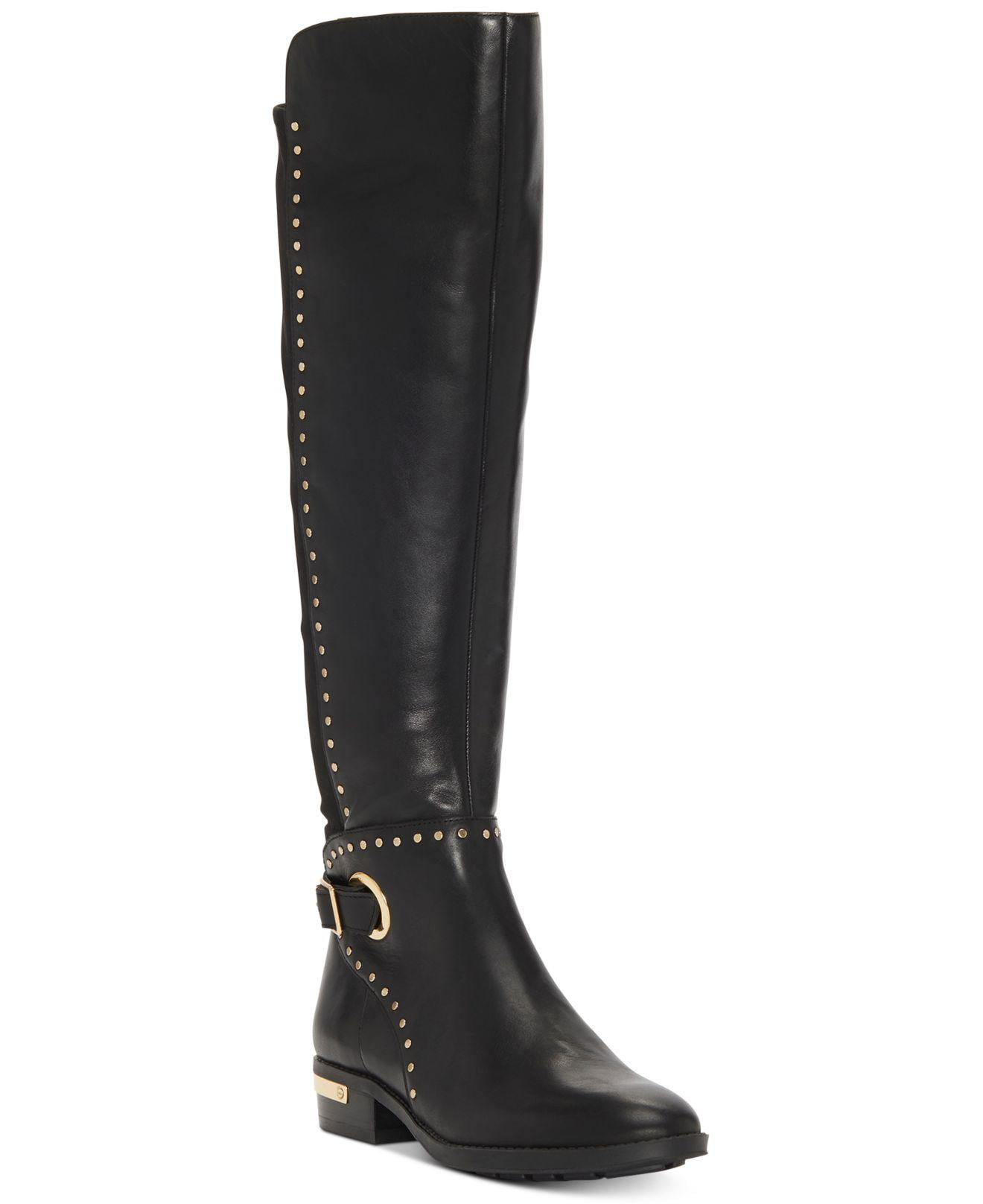 black and gold riding boots