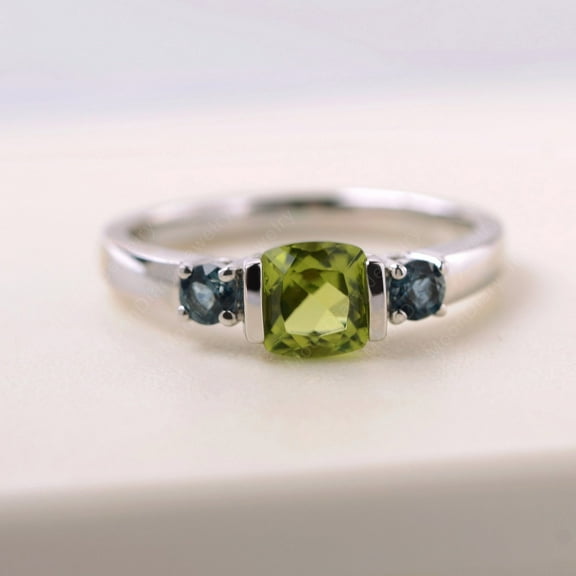 Cushion cut 6 mm peridot ring with London blue topaz side stones custom August/ November birthstone ring