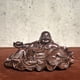 thumbnail image 1 of Ebony wood carved Maitreya Buddha with ingot shape, symbolizing harmony and wealth, a large-bellied Buddha, a desktop ornament, a car decoration, a wooden handicraft., 1 of 3